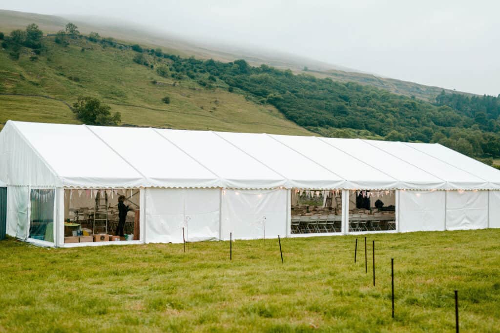 Large white clearspan frame marquee for a wedding in a Yorkshire valley.
